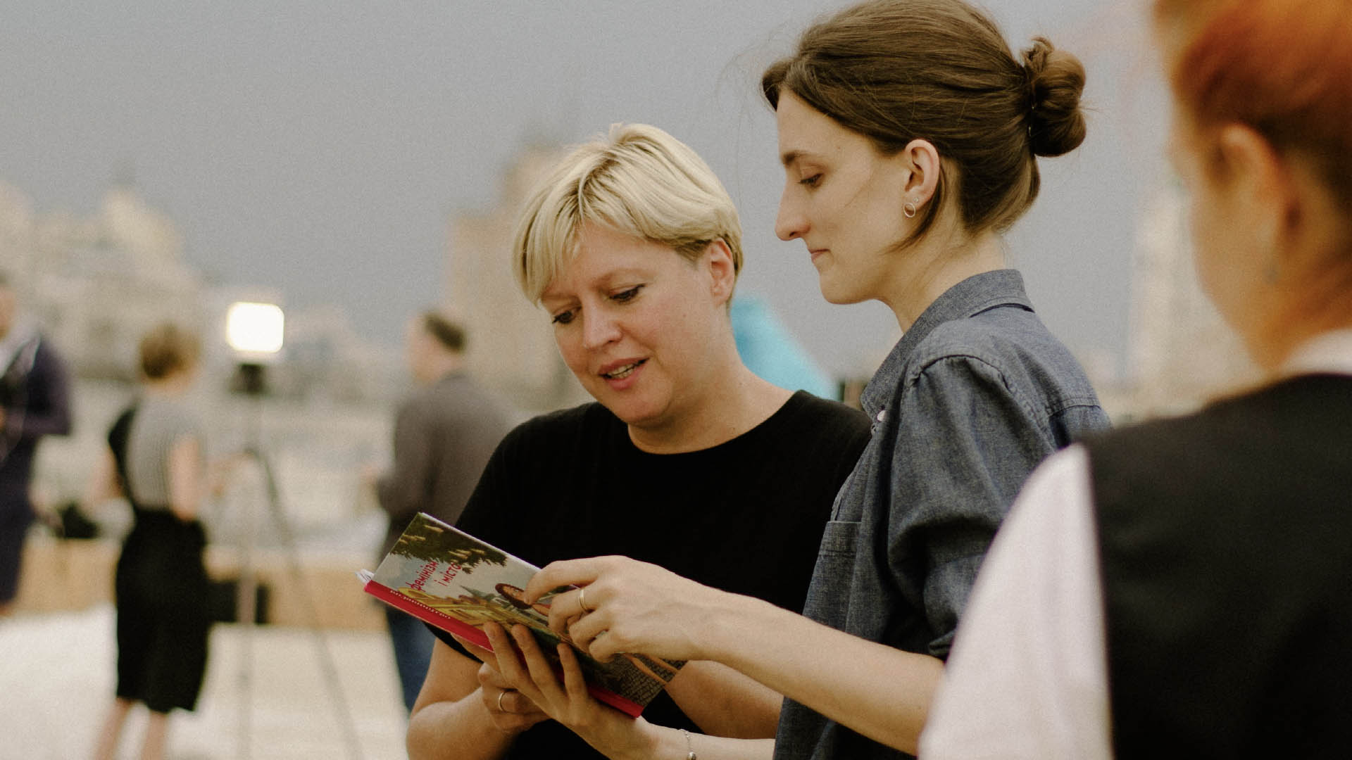 Two women looking through a brochure